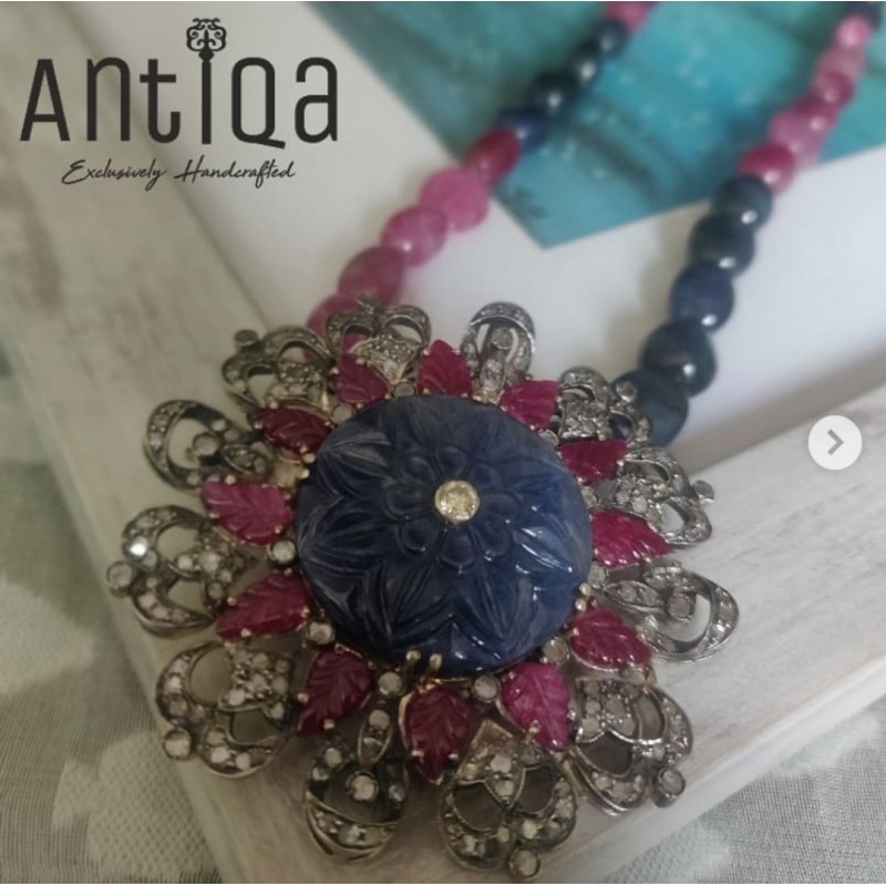 Handcrafted Pendant Studded With Carved Blue Sapphire, Ruby And Mell Diamonds